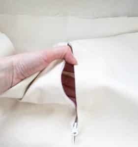 A perfectly sewn zipper into the ottoman