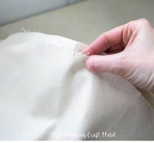Aligning the circular piece with square piece of cotton canvas