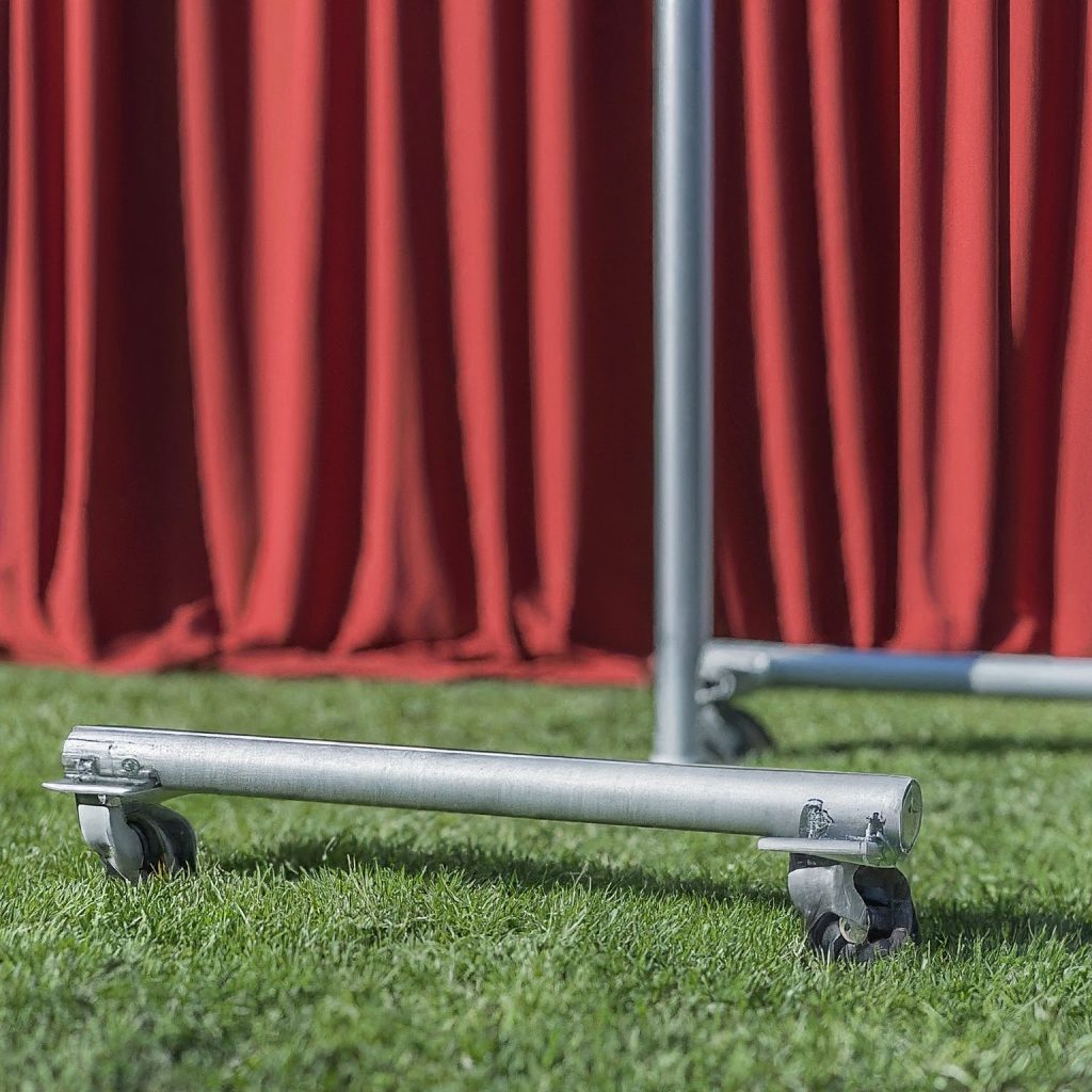 Adjustable baseplate with leveling feet for pipe and drape on uneven terrain